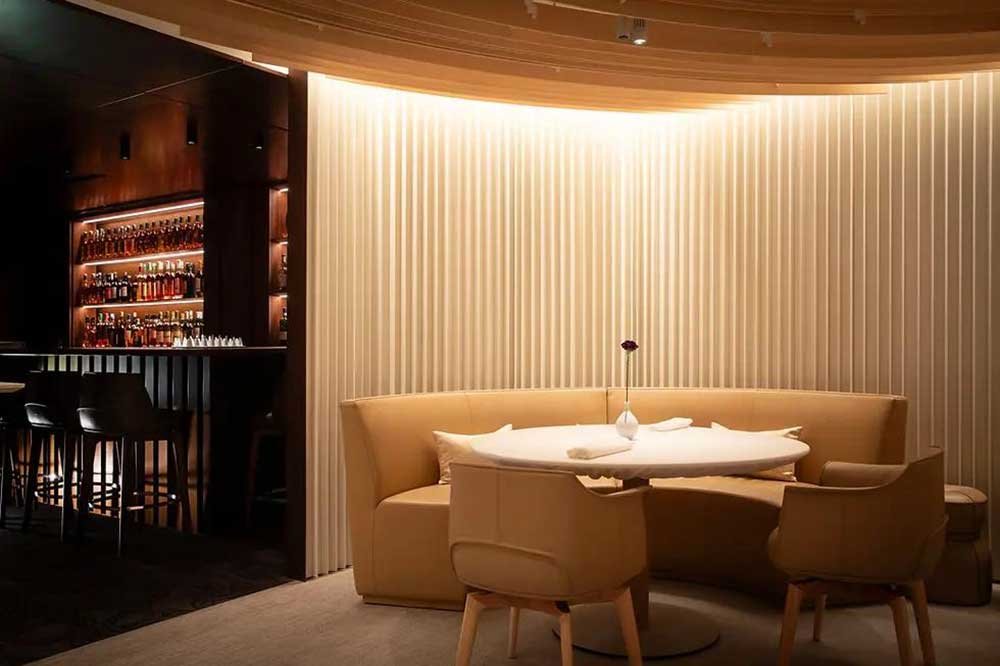 Ivory White Round Fluted WPC Wall Panels for Bar Interior Design